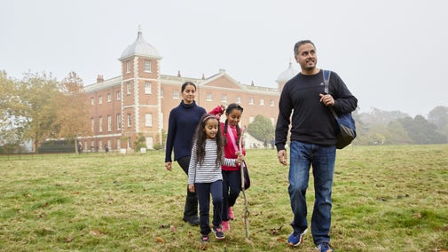 A family walking in the grounds at Osterley Park and House, London